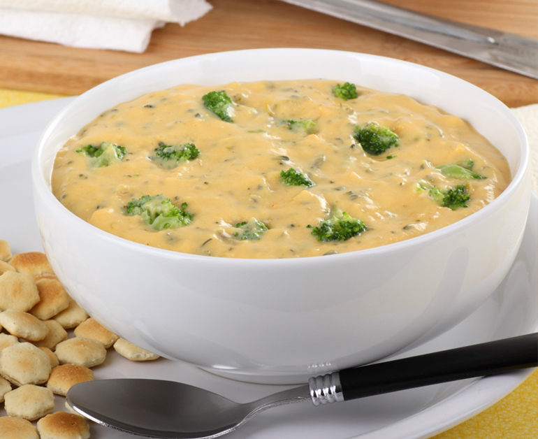 cheddar broccoli soup in a white bowl