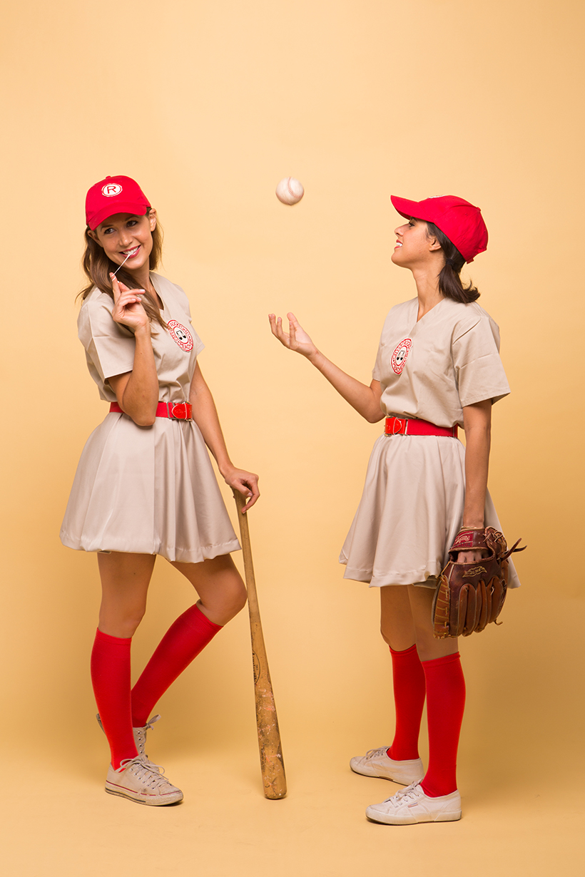 2 women dressed as early 1900s baseball players