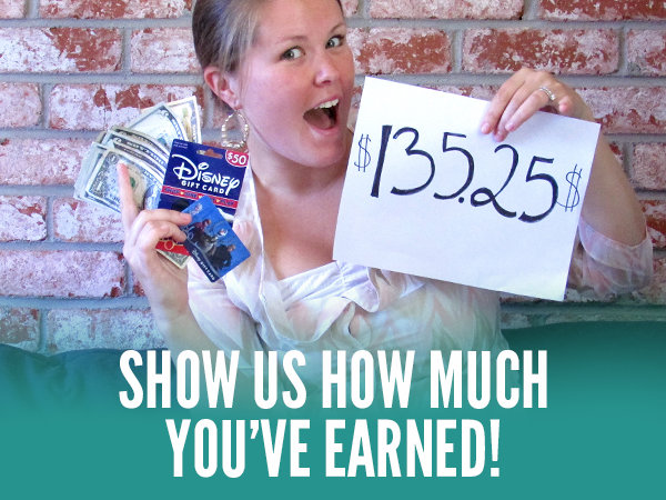 Woman showing how much money she's saved so far with Ibotta - $135.25 and Disney and other gift cards in hand