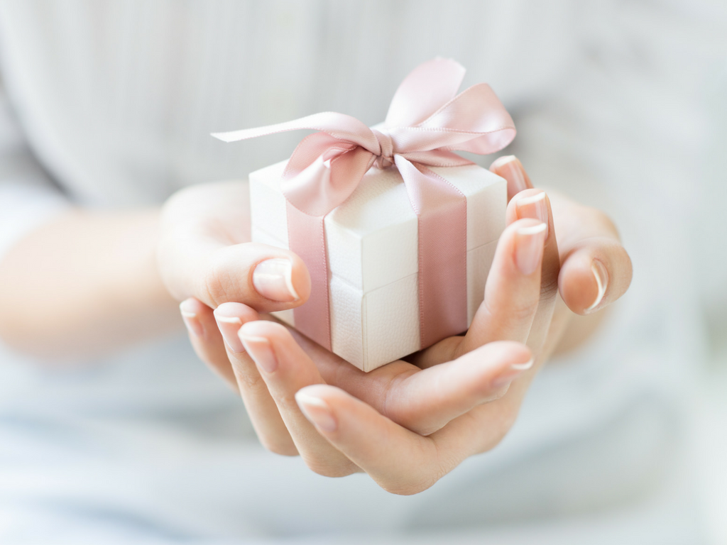 Woman holding wrapped gift
