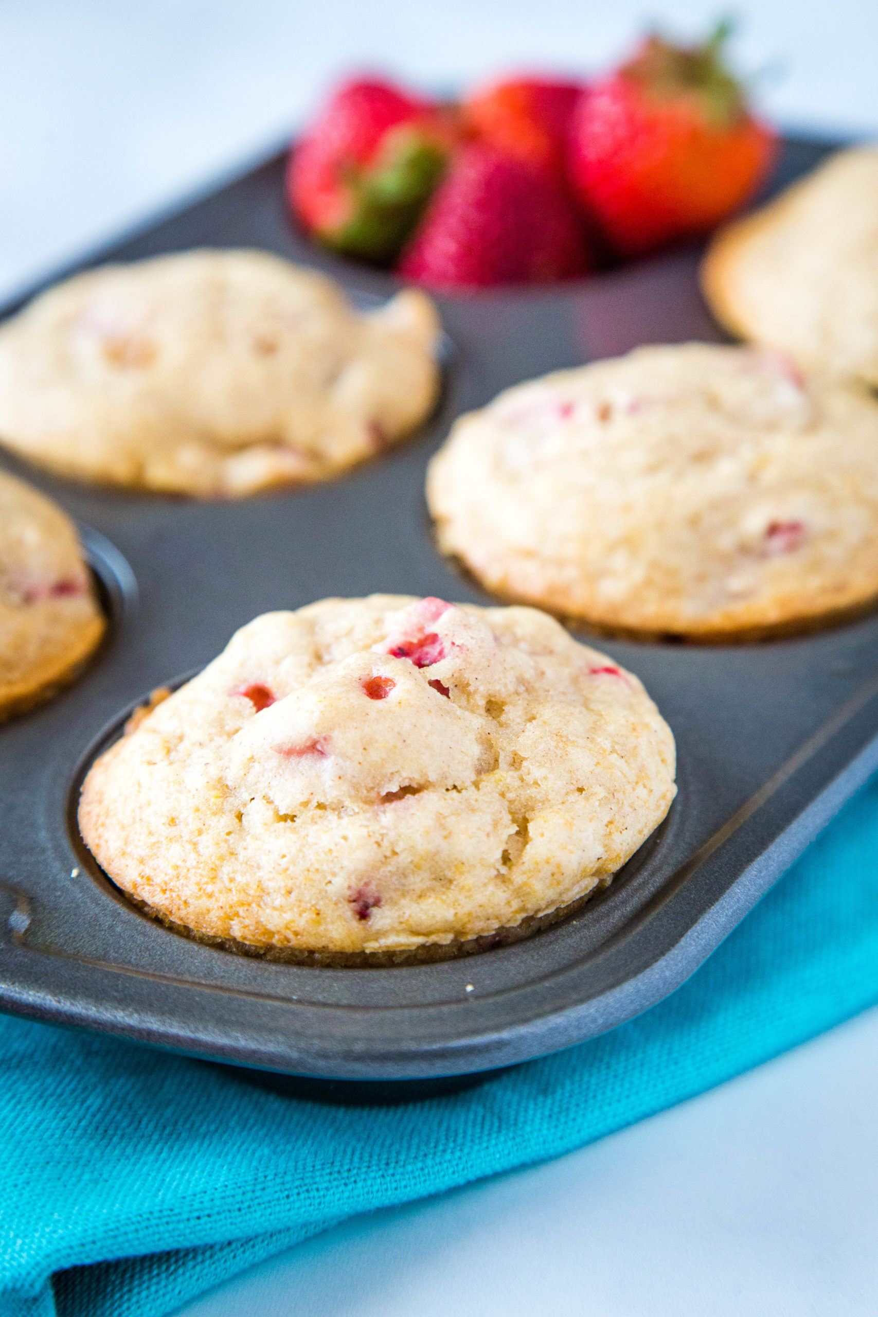 Strawberry muffins in a tin