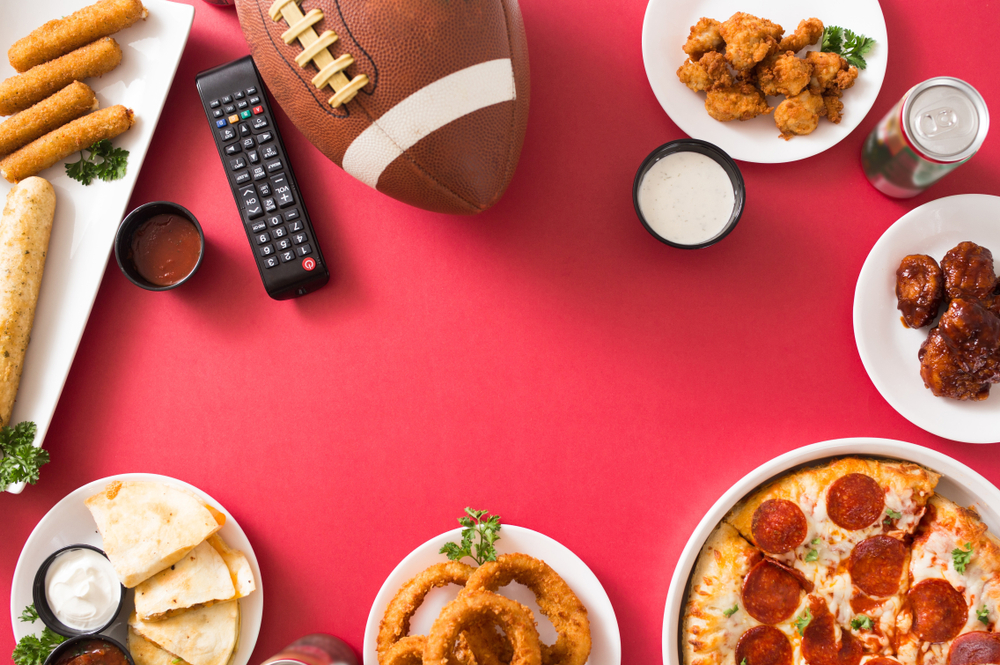 A table spread full of festive snacks to celebrate the big game
