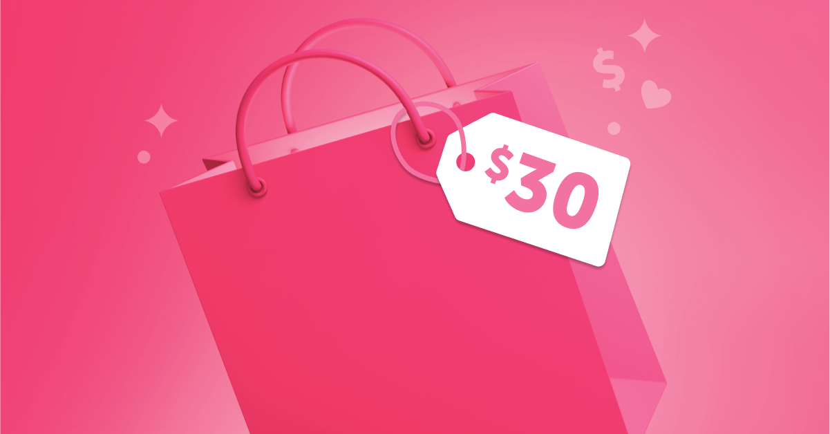 Pink gift bag with $30 gift tag in front of a pink background